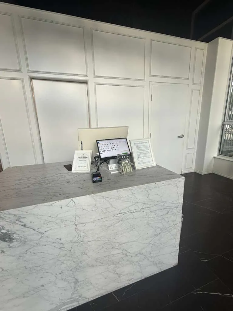 Marble checkout counter inside Central Cleaners on Central Avenue