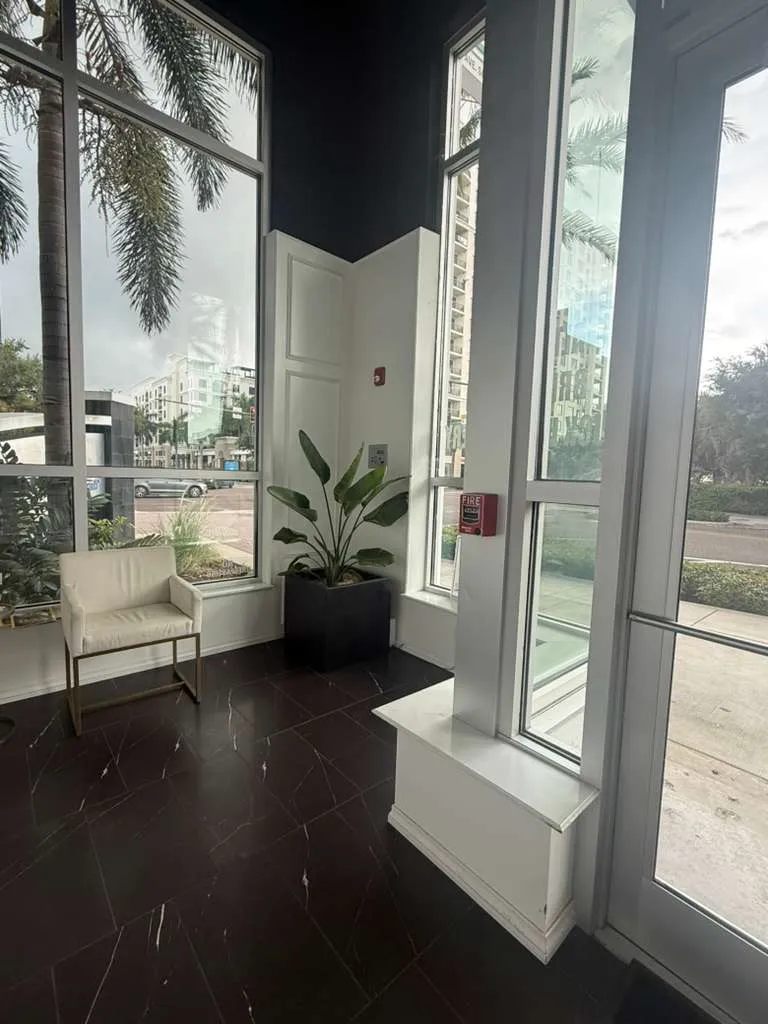 Bright customer waiting area inside Central Cleaners overlooking Central Avenue